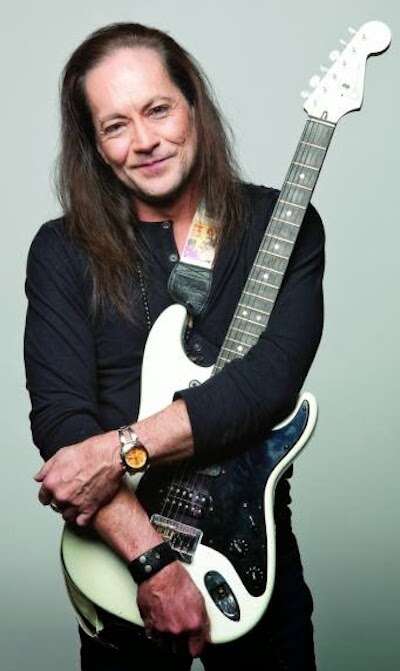 Who Played Guitar On Bark At The Moon: The Answer